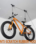 Mounted ceiling bike with bright orange frame using Ceiling Bike Mount Hanger Set Built Tough Steel Bicycle Lift Hoist With Safety Lock Adjustable Height Pulley System For Garage Storage Indoor Bike Hooks Two Pack.