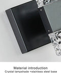 Close-up of Black 4 Light Crystal Bathroom Vanity Light Over Mirror LED Wall Fixture, showing stainless steel base with ice cube accents.