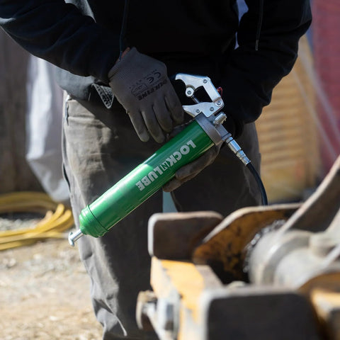 Person using Heavy Duty Pistol Grip Grease Gun With Patented LockNLube Coupler Locks On And Does Not Leak, 20 Inch Hose
