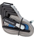 Band Clamp Accessory Kit With Plastic Boot And Rubber Retainer Strap For 1 X 15 Band Clamp And Older Clamps Helps Align Nylon Band When Rolling Up And Keeps Your Setup Tight And Ready To Go, shows folded clamp with Rockler branding