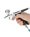 Slick Dual Action Pistol Trigger Spray Gun And Airbrush Kit Featuring Ace 0.3mm 0.5mm 0.8mm Tips with hand holding the sprayer.