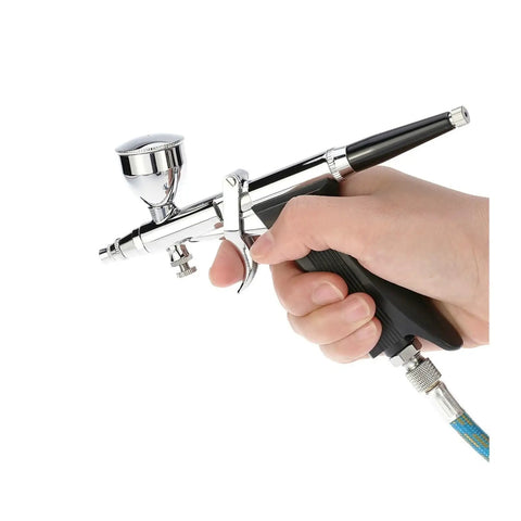 Slick Dual Action Pistol Trigger Spray Gun And Airbrush Kit Featuring Ace 0.3mm 0.5mm 0.8mm Tips with hand holding the sprayer.