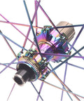 Close-up of colorful hub on Beefy 50mm Carbon Fiber Road Wheelset with 24 spokes, center lock disc brake.