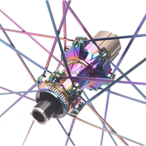 Close-up of colorful hub on Beefy 50mm Carbon Fiber Road Wheelset with 24 spokes, center lock disc brake.