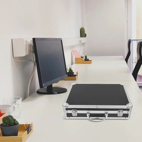 Slick Aluminum Alloy Toolbox Briefcase With Heavy Duty Hard Shell Design On Desk Next To Monitor And Plants