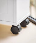 Close-up of wheels on Slim Toilet Storage Cart With Wheels For Narrow Spaces 3 Tier Organizer For Toilet Paper Rolls BZR31-W