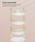 Exploded view of Three Tier Round Rotating Makeup And Skincare Organizer assembly with metal rods and cloud white tiers.