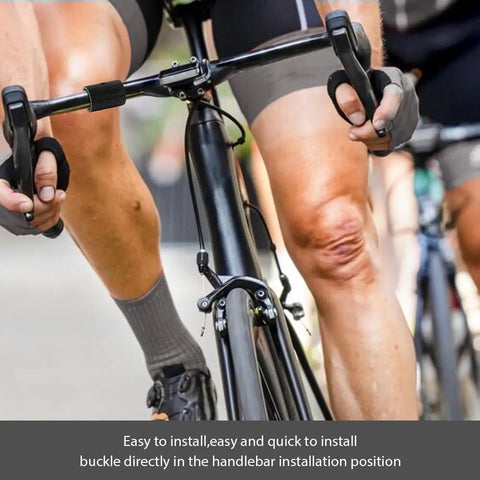 Cyclist gripping handlebars with view of Bike Handlebar Shim Set 1 Pair 25.4 To 31.8 Mm Aluminum Alloy Clamp Spacer Conversion Adapter.