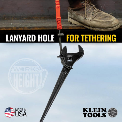 Heavy Duty Adjustable Spud Wrench 16 Inch Long With 1 5 8 Inch Opening Fits Heavy Nuts And Bolts Up To 1 Inch Forged In USA Tether Hole For Safe Work Lanyard Compatible Built For Tough Job Sites hanging from a lanyard on a work boot.