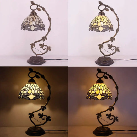 Amber Tiffany Style Dragonfly Table Lamp with stained glass shade and metal leaf base shown lit and unlit in different angles.