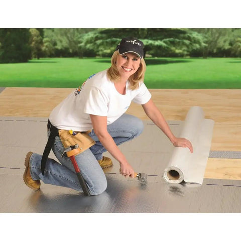 Person installing Peel and Seal Self Stick Roll Roofing Aluminum 36 Inch Wide Durable Self Adhesive Roofing Material For Quick Patches