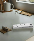 Heavy Duty Stainless Steel Hidden Door Pivot Hinge With 360 Degree Rotation for Secret Doors and Bookshelves, displayed on desk