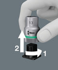 Hand using twist unlock on Zyklop 9-Piece Socket Set On Belt, Three Eighths Inch Drive, demonstrating quick removal and tool attachment.