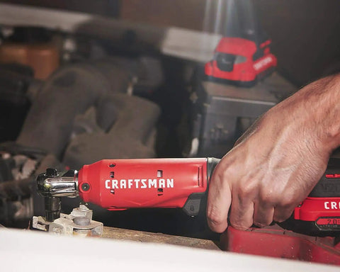 Hand using V20 Cordless 3/8 Inch Ratchet Wrench Bare Tool Only, 300 RPM, Up To 35 Ft-Lbs Torque, LED Work Light on car engine