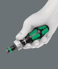 Compact 17 Piece Ratchet Bit Set With Rapidaptor Technology For Tight Spots Anti Roll Handle in hand, side view