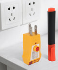 All-in-One Grounding Tester Kit With GFCI Outlet Checker And Conductivity Pen on desk with US standard outlets