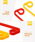 Close-up of red and yellow durable plastic mower blades from 20 Pack Durable Plastic Grass Mower Blades Replacement for Lawn Care.
