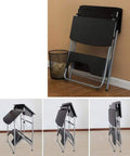 Adjustable Height Sit Stand Workstation Mobile Standing Desk Foldable Computer Table With Sturdy Waterproof Surface in folded position against wall.