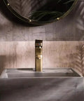 UMJIGF Vessel Sink Small Apartment Above Counter Basin Concrete Wash Basin with stylish gold faucet and textured background.