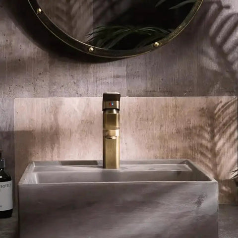 UMJIGF Vessel Sink Small Apartment Above Counter Basin Concrete Wash Basin with stylish gold faucet and textured background.