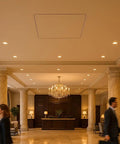 Super Tight Flush Mount Ceiling Access Panel For Drywall With A Rock Solid Forty Five Minute Fire Rating And Tough GFRG Alternative Frame Featuring Zero Hassle Gravity Closure Made In Usa For A Perfect Eighteen By Eighteen Inch Ceiling Opening in a luxurious lobby setting.