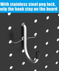 Metal hook with peg lock from 157 Piece Extra Thick Pegboard Hook Set on quarter inch pegboard, ideal for garages.