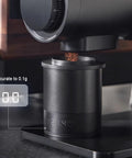 Total Game Changer Aluminum Coffee Dosing Cup And Espresso Digital Scale Combo With Rechargeable Sensor And 0.1 Gram Precision For Classic 58Mm Portafilters Rock Solid Gear showing precision scale measuring coffee grounds.