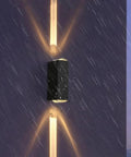 Modern Led Outdoor Wall Sconce,2-Pack 20w Updown Wall Wash Light,Black Metal Ip65 mounted on a wall in the rain.