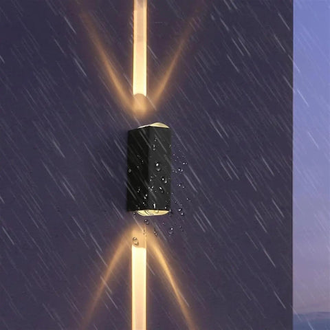 Modern Led Outdoor Wall Sconce,2-Pack 20w Updown Wall Wash Light,Black Metal Ip65 mounted on a wall in the rain.