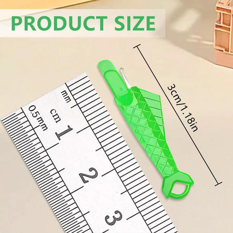 Fish Mouth Needle Threader For Sewing Machines And Hand Use Automatic Needle Threader Tool next to ruler for size comparison