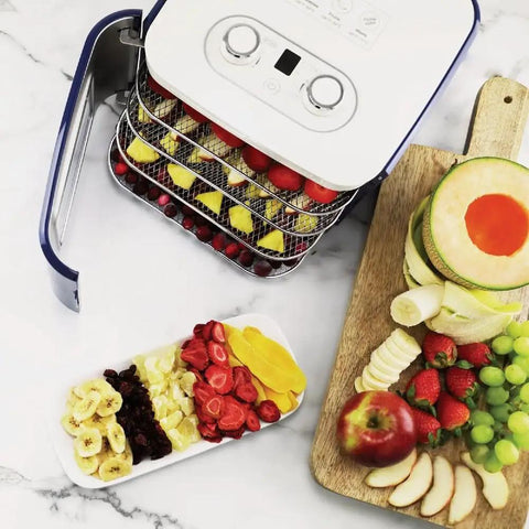 Countertop Food Dehydrator With Four Trays For Whipping Up Dried Fruit Veggie Chips And Snack Batches showing trays with fruits.