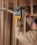 Worker using Ship Auger Drill Bit For Hardwood And Nail Embedded Wood, 1 Inch By 17 Inch, in construction setting