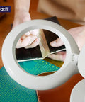 Close-up of All In One LED Magnifying Lamp with Dust Cover, 5 Inch Glass Lens, 5 Diopter showing detailed crafting work.