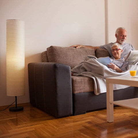 Modern Tall Floor Lamp With Dimmable Three-Level Brightness, Paper Lampshade, beside a sofa in a cozy living room