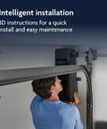 Person installing Ultra Quiet Wall Mount Garage Door Opener With Battery Backup And MyQ Smart WiFi Control LED Lighting
