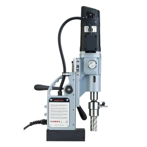 Premium Magnetic Drill Press With Rock Solid 1850 Lb Hold Fast And Killer 14.5 Amp Motor For No Sweat Metal Cutting Up To 2 3 16 Inch Annular Hole Saw Capacity Featuring Oil Lubricated 2 Speed Gearbox For Heavy Construction Jobs, side view with detailed controls.