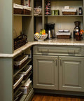 Kitchen pantry with Five Inch Center To Center Warm Champagne Bronze Modern Cabinet Pulls in Brushed Zinc Alloy on green cabinets.