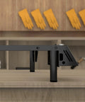 Level Up Your Shop With This Straight Fire 360 Degree Laser Rotary Roller And 8 Piece Riser Pads Kit For Ray 5 Engraver side view on a workbench.