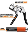 Lnchett grease gun with orange grip and black cartridge, front view; shows quick-release coupler.