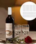 Snag These White PVC Heat Shrink Wine Bottle Caps A Dope One Hundred Pack To Keep Open Bottles Fresh With An Airtight Seal That Kills Oxidation Cold Zero Fuss Just Heat For A Snug Fit Around Any Neck Sweet For Weekend Sipping Or Quick Stashing. Image features a wine bottle sealed with a white PVC cap.