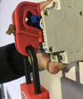 Legit Heavy Duty Universal Circuit Breaker Lockout Three Pack With Padlock Shackle on a circuit breaker, showcasing tool-free setup.
