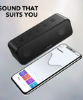 3 Portable Bluetooth Speaker That Delivers Dope Sound With IPX7 Waterproof Build 24 Hour Playtime Titanium Diaphragm Drivers next to phone with EQ app.