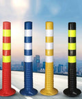 Rock Solid 29.5 Inch Reusable Delineator Post Featuring Sharp Reflective Stripes For No Sweat Parking Lot Flow And Reliable Road Work Zone Safety Markers Black Two Pack - red, blue, yellow, and black delineator posts shown outdoors.