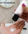 Person squeezing liquid from 5 Pack 3.4 Oz Travel Bottles With Labels Leakproof Plastic Containers TSA Approved Travel Size Empty Bottles Set
