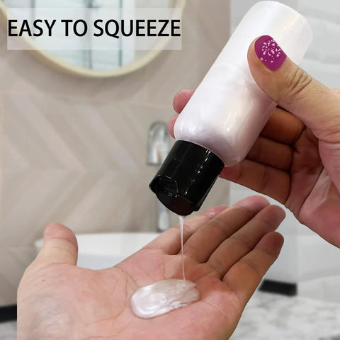 Person squeezing liquid from 5 Pack 3.4 Oz Travel Bottles With Labels Leakproof Plastic Containers TSA Approved Travel Size Empty Bottles Set