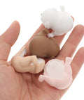 Hand holding various colors of 8 Pack Silicone Table Corner Protectors With Cartoon Puppy Design Kid And Pet Safe Edge Guards