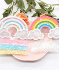 Rainbow Shaker Bag Topper Die Set for DIY Scrapbooking and Photo Albums with colorful sequins and floral background.