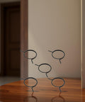 5 Pack Black Door Handle Springs For Standard Lever Knobs And Latches, Torsion Coil Spindle Repair Kit on wooden surface