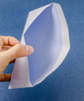Hand holding 100 Pack White Privacy Pattern Envelopes Self Sealing Mailers showcasing interior privacy pattern detail