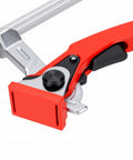 Close-up of Heavy Duty Bench Dog Clamp Five Eighth Inch Hold Down Ratchet Clamp with red jaws for woodworking.